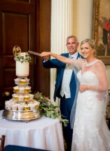 Hintlesham Hall Wedding Suffolk couple cutting cake